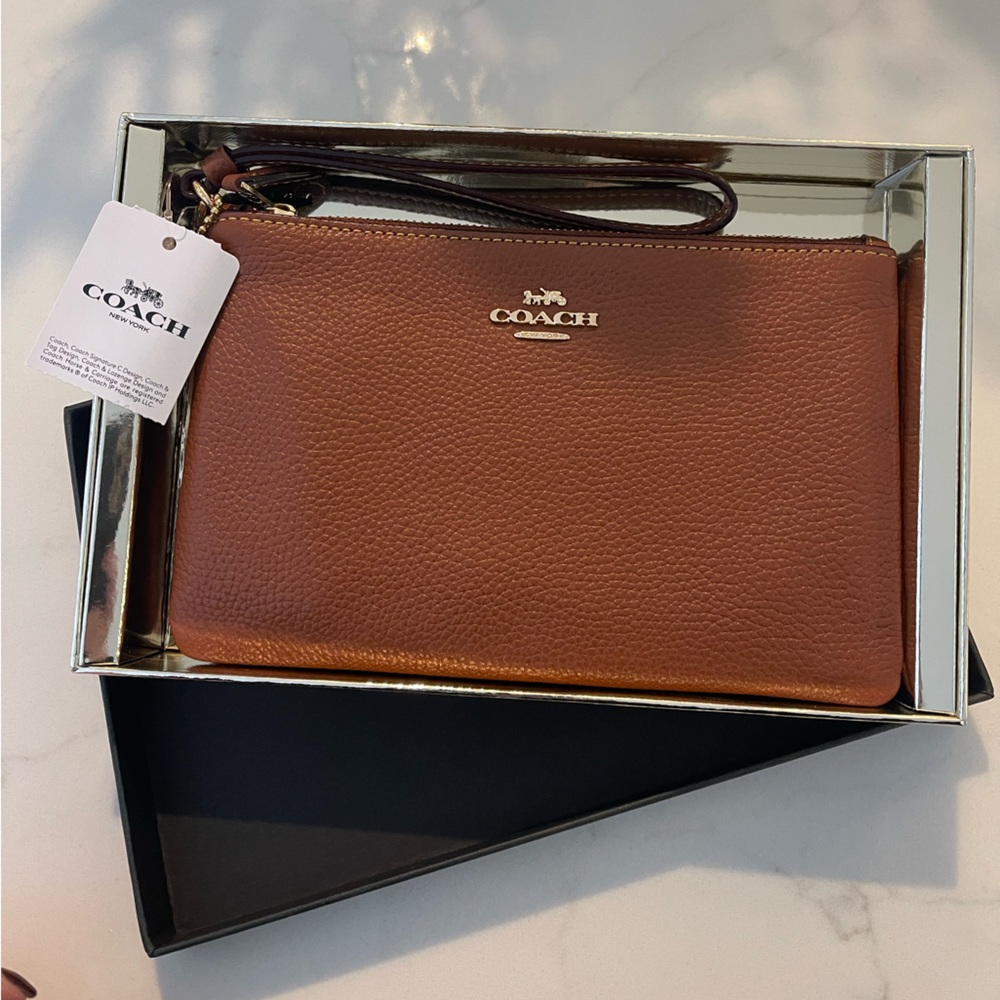 - Coach leather wristlet